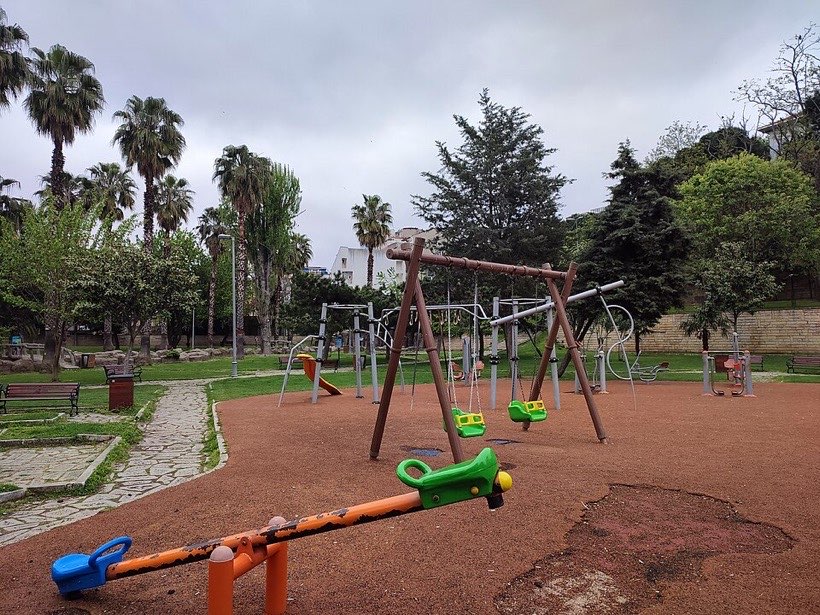 A playground has swings and slides for moving in different ways.