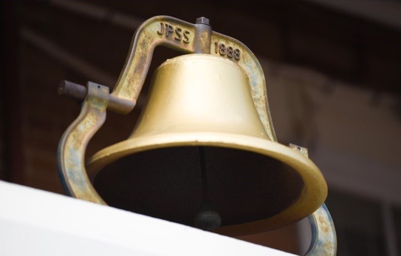 A ringing bell can be heard from far away.