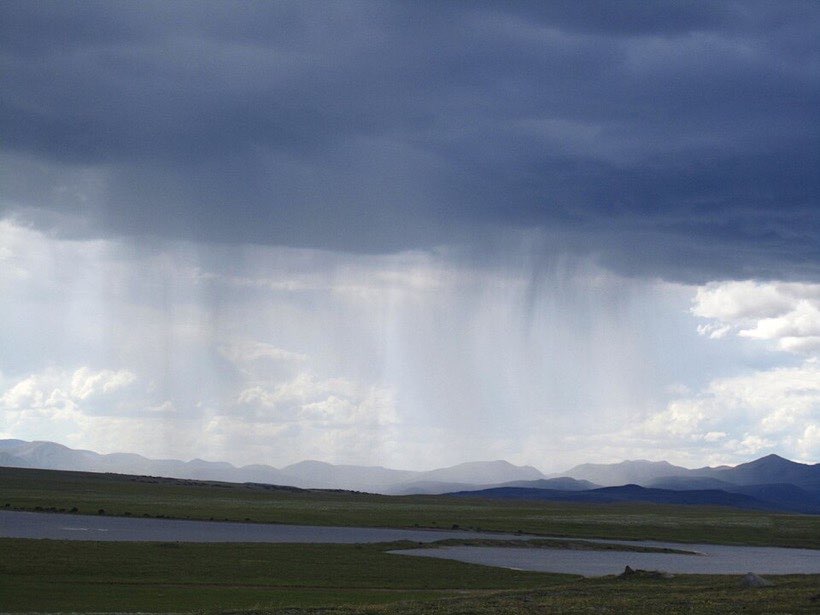 Dark clouds bring rain to the fields.