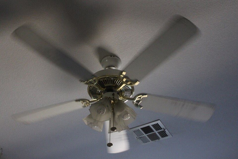 A ceiling fan uses electricity to move air and cool a room.