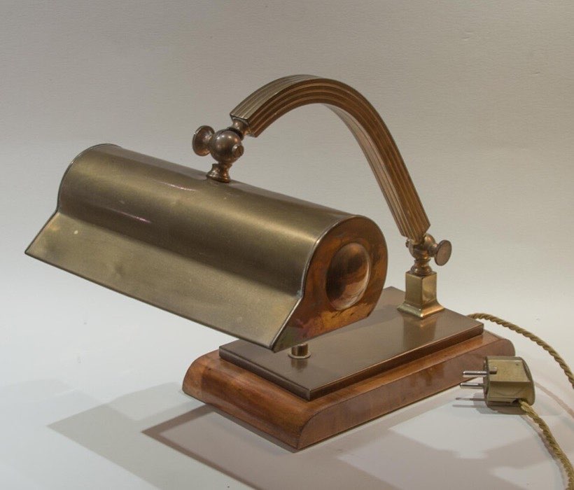A desk lamp changes electrical energy into light (and some heat).