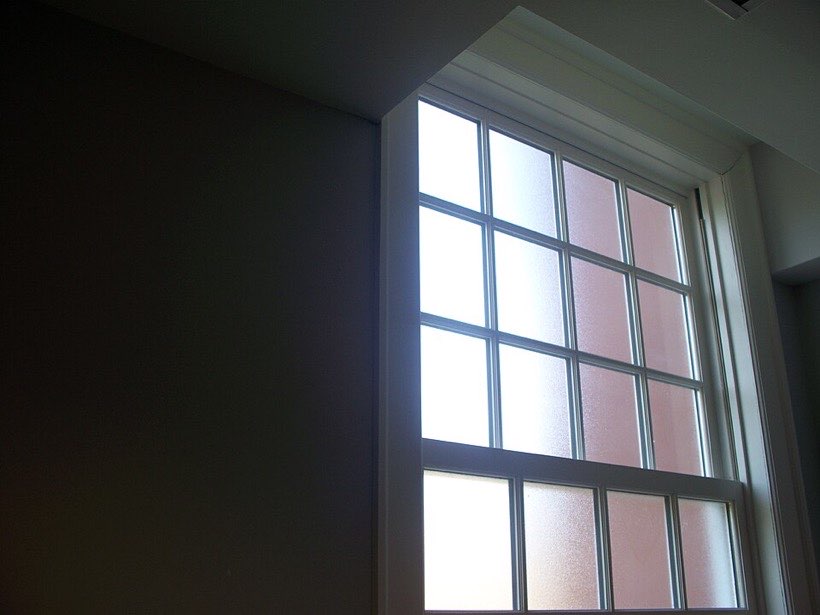 A window: the glass is transparent and the wooden frame is opaque.