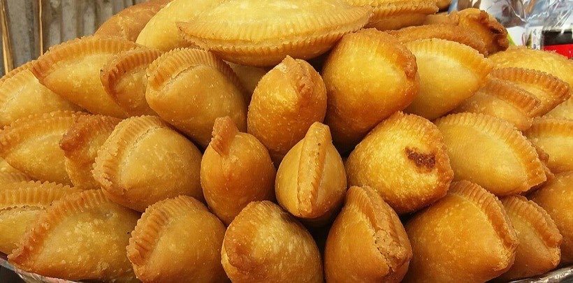 Pitha shared out at a winter festival.