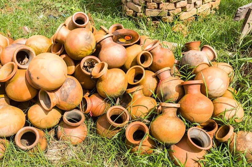 Clay pots of different sizes hold different amounts.