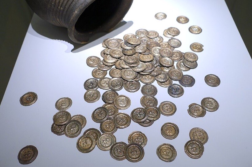 Coins saved up. Spending takes money away.