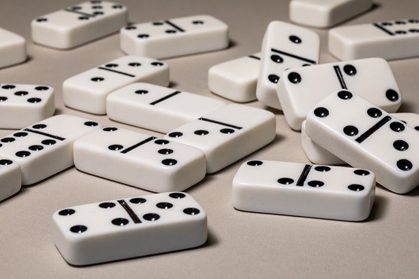 Each domino shows two numbers. Together they make a total.