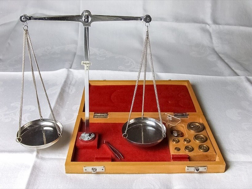 A balance scale is level when both sides weigh the same.