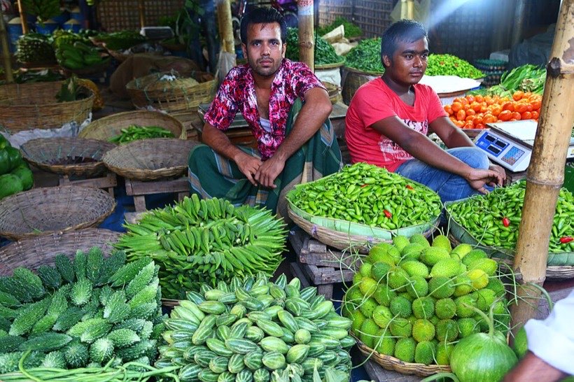 Market sellers add totals quickly.