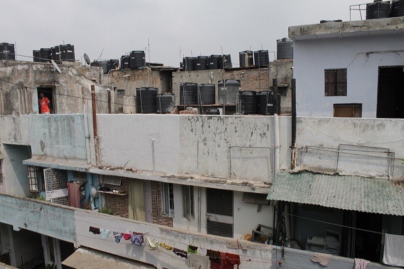 Rooftop water tanks store water for a building.