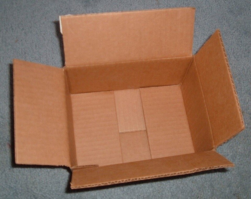 A cardboard box can be opened out flat.