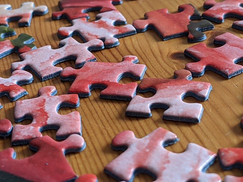 Jigsaw pieces are slid and turned to fit.