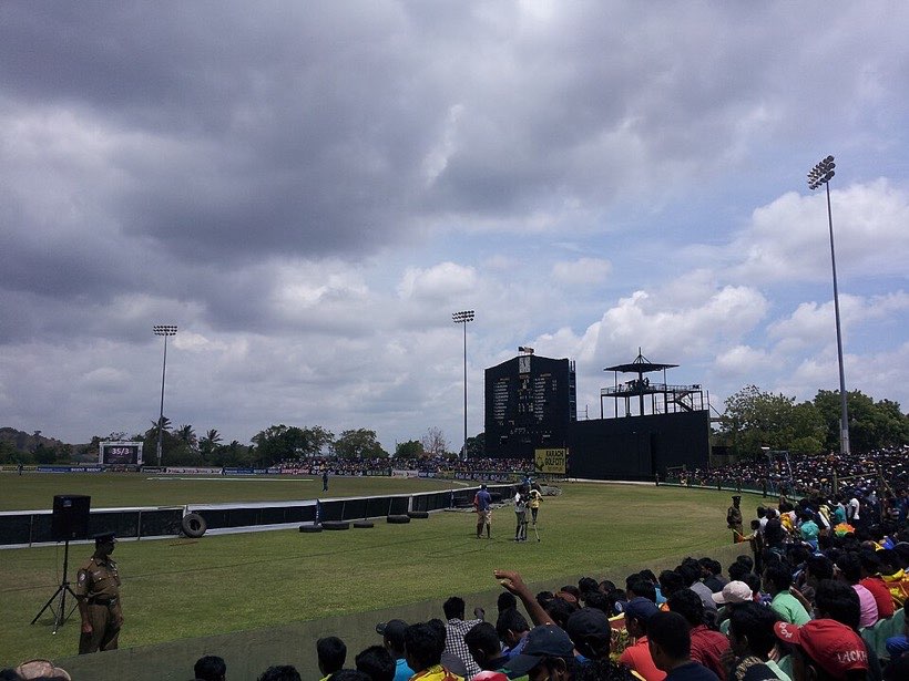 A scoreboard shows runs adding up.