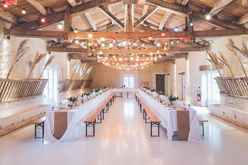 Tables pushed together for a wedding feast.