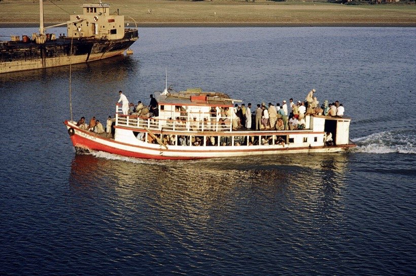 A river launch carrying passengers.
